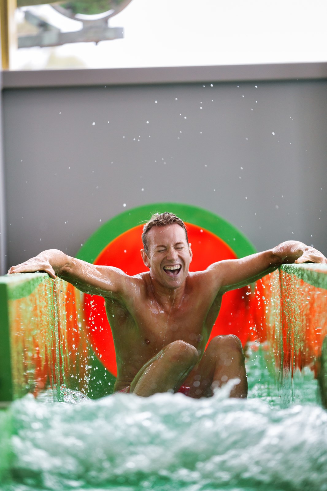 Man going down waterslide